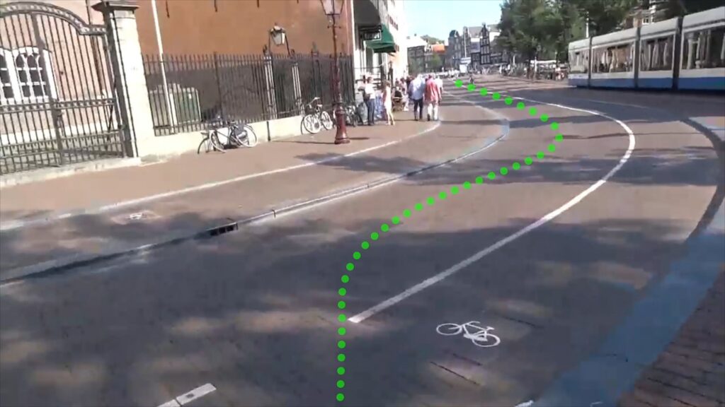 AR prototype view: the green dotted route curving along a bike lane