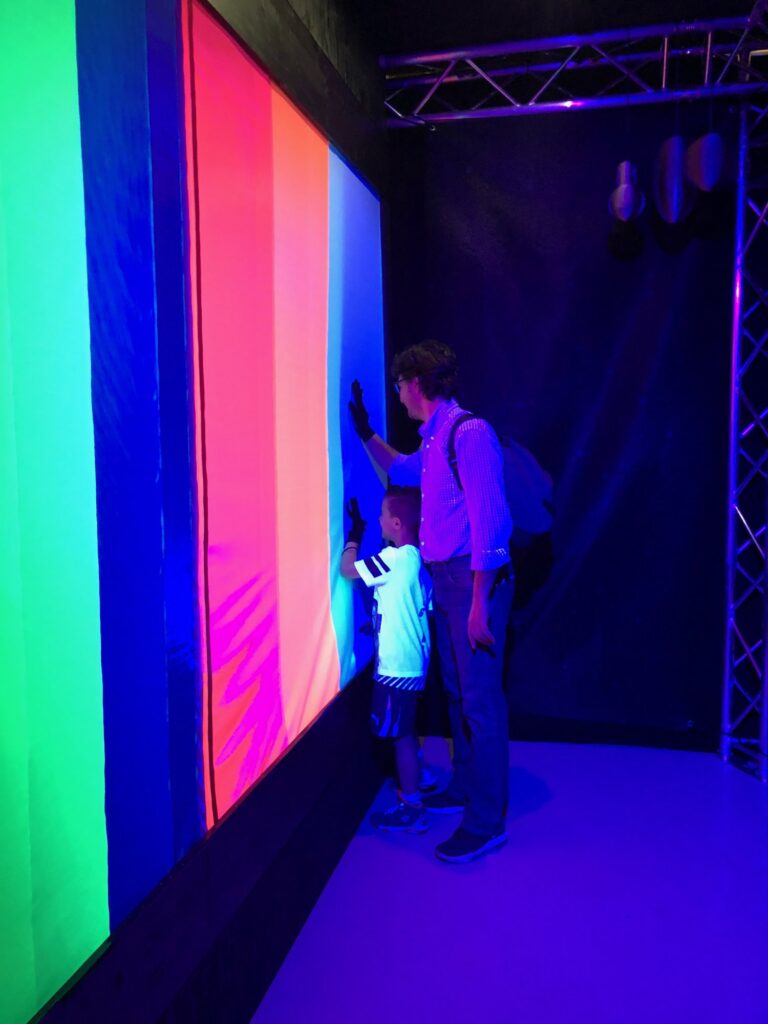 The finished Hello Stranger installation with visitors at the wall