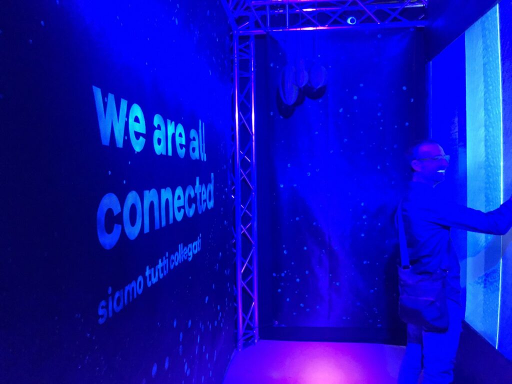 We are all connected, siamo tutti collegati, projected next to the installation